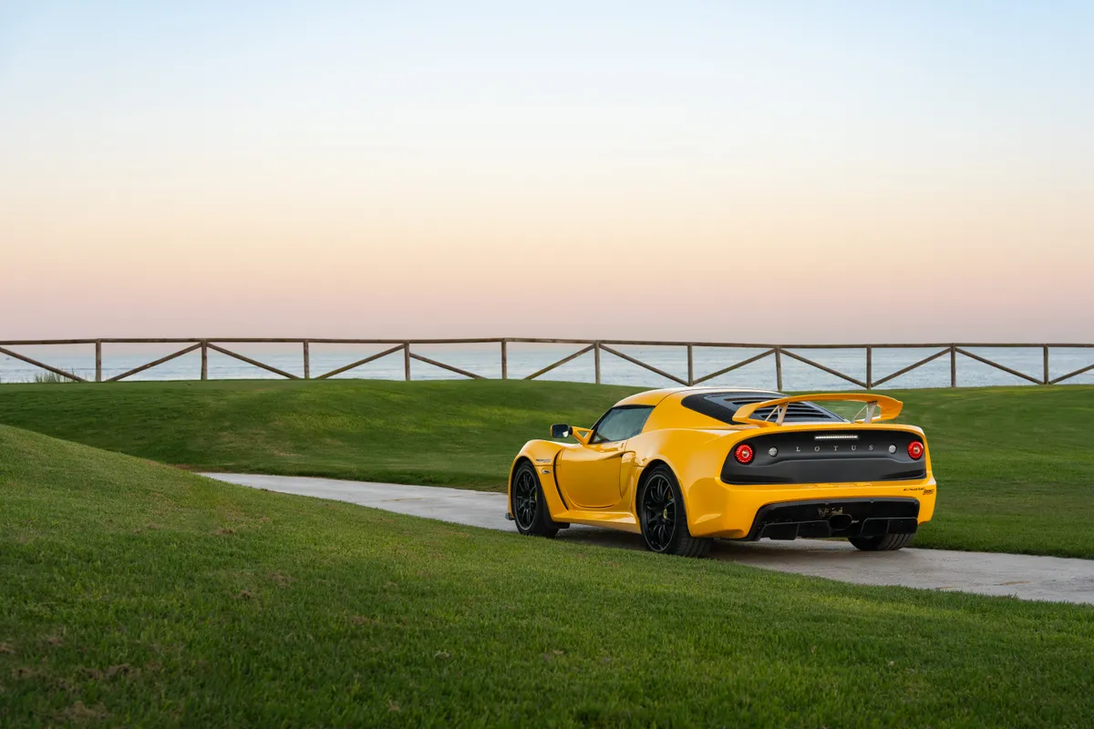 Rear three-quarter of the Exige showing the wing and diffuser