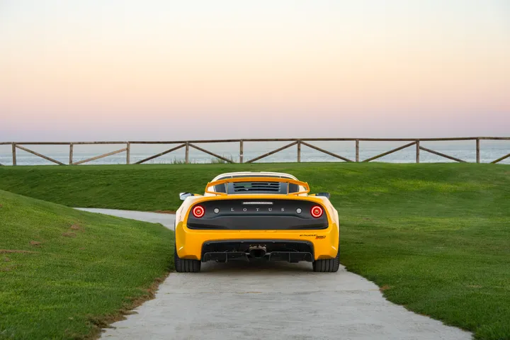 The Exige dead-on from behind, rear wing squared to camera