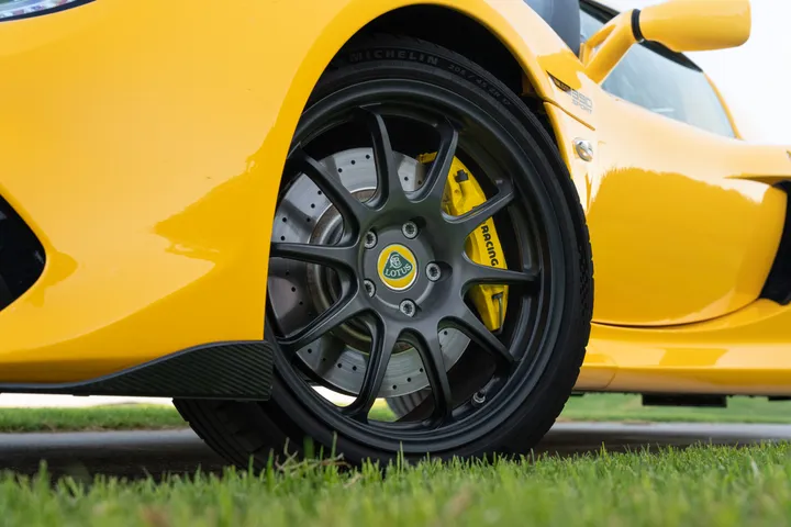 Close detail of a forged wheel and yellow brake caliper