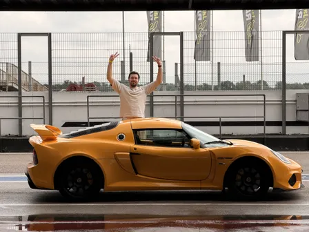 The owner stood beside the Exige in the pit lane, arms in the air